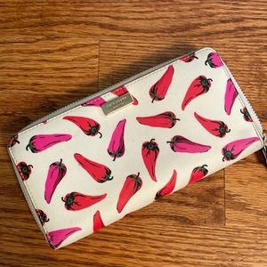 Classic Kate Spade wallet with whimsical pepper design